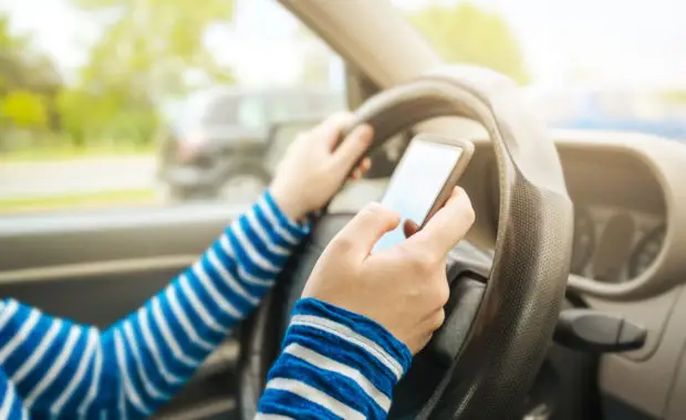 An irresponsible texting driver is about to run over a pedestrian at an intersection which shows how dangerous texting and driving is. Stop the text and stop the wrecks.