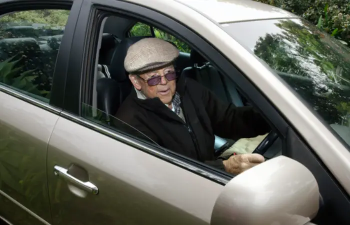 A very old man with a valid driving license drives his car